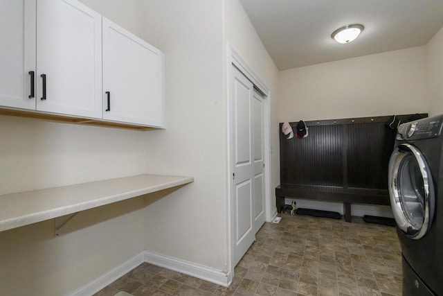 12907 78th Pl, Bristol, WI 53104 - laundry room featuring washer / dryer, cabinet space, and stone finish floors