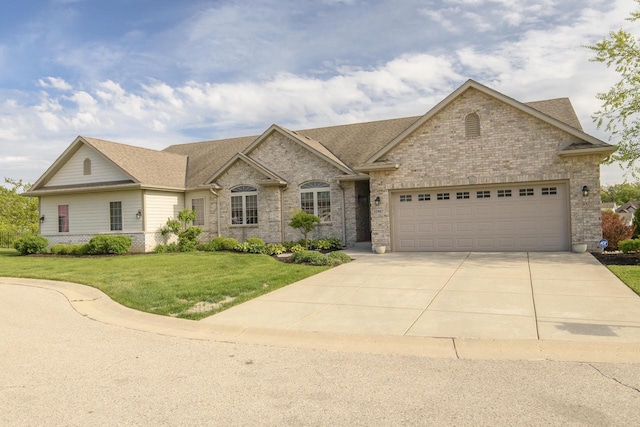 12907 78th Pl, Bristol, WI 53104 - view of front of property featuring brick siding, driveway, a garage, a front lawn, and roof with shingles