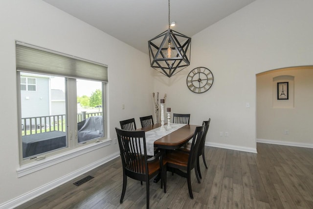 12907 78th Pl, Bristol, WI 53104 - dining area featuring dark wood-style floors and arched walkways