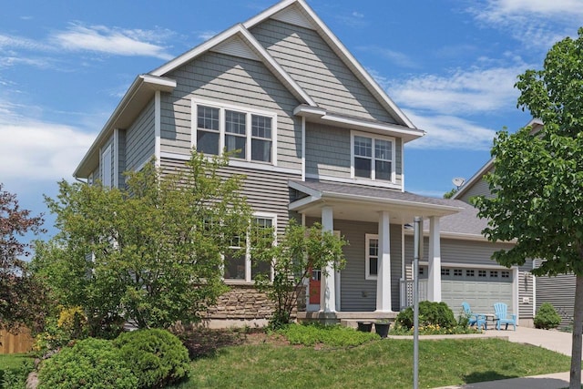 9414 Harvest Moon Ln, Verona, WI 53593 - view of front facade with covered porch, a front yard, and driveway