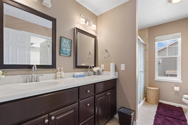 9414 Harvest Moon Ln, Verona, WI 53593 - full bath with double vanity, a shower stall, and tile patterned floors