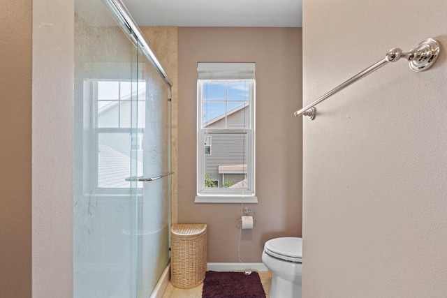 9414 Harvest Moon Ln, Verona, WI 53593 - bathroom featuring a shower with shower door and toilet