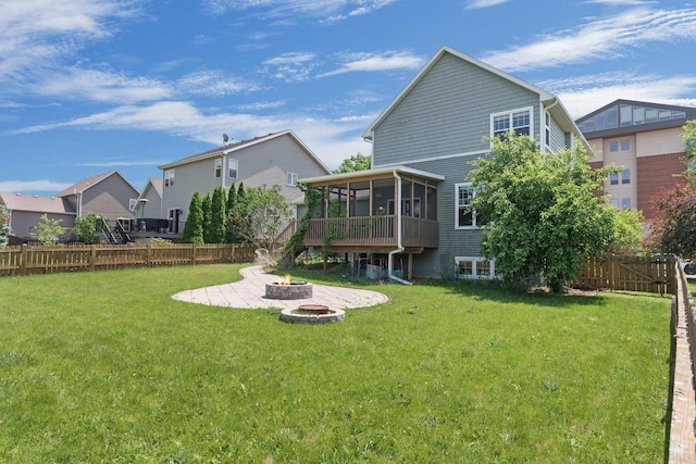 9414 Harvest Moon Ln, Verona, WI 53593 - back of property featuring an outdoor fire pit, a sunroom, a fenced backyard, a residential view, and a patio area