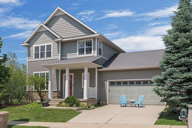 9414 Harvest Moon Ln, Verona, WI 53593 - view of front of house with covered porch, a garage, and driveway