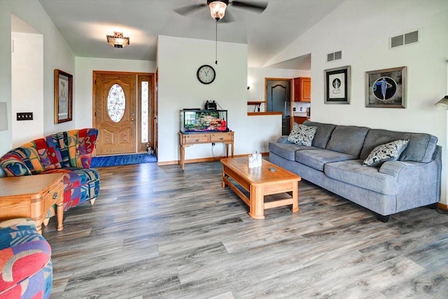 830 Violet Ln, Oregon, WI 53575 - living area featuring a ceiling fan, wood finished floors, and vaulted ceiling