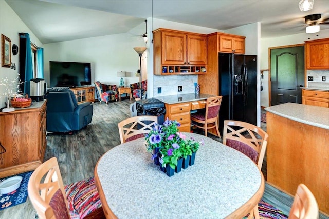 830 Violet Ln, Oregon, WI 53575 - kitchen featuring a ceiling fan, black refrigerator with ice dispenser, dark wood-style flooring, brown cabinets, and backsplash