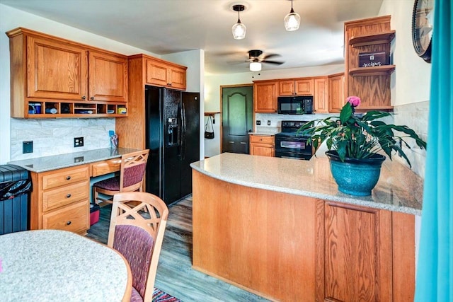 830 Violet Ln, Oregon, WI 53575 - kitchen with black appliances, open shelves, built in study area, a ceiling fan, and backsplash
