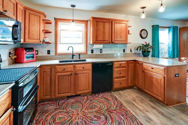 830 Violet Ln, Oregon, WI 53575 - kitchen featuring black appliances, open shelves, a peninsula, and light countertops