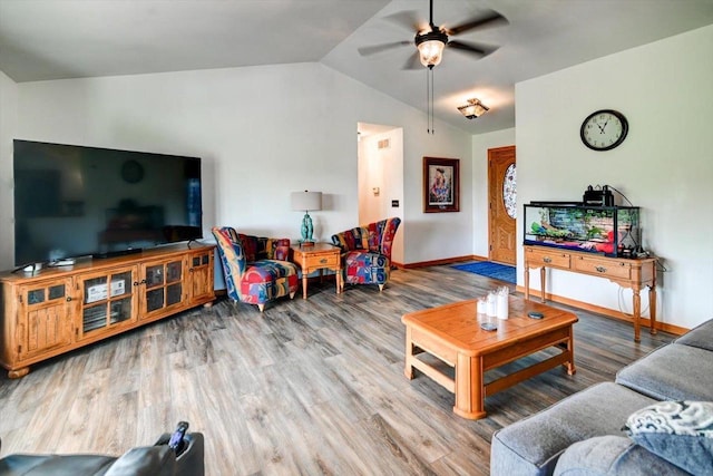 830 Violet Ln, Oregon, WI 53575 - living area featuring lofted ceiling, wood finished floors, and ceiling fan