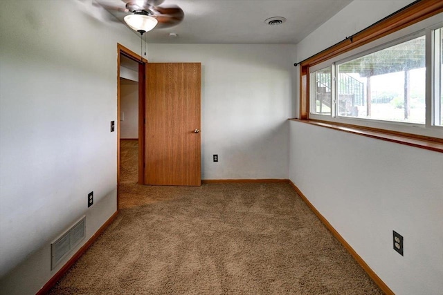 830 Violet Ln, Oregon, WI 53575 - carpeted empty room with ceiling fan and baseboards