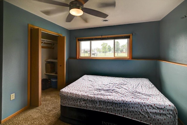 830 Violet Ln, Oregon, WI 53575 - carpeted bedroom featuring a closet and a ceiling fan