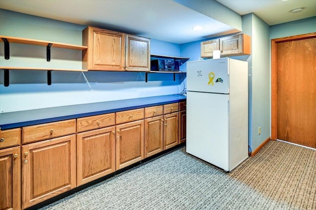 830 Violet Ln, Oregon, WI 53575 - kitchen featuring open shelves, freestanding refrigerator, light carpet, dark countertops, and brown cabinets