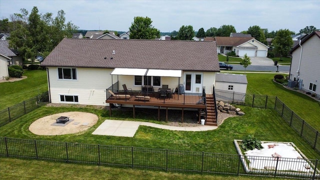 830 Violet Ln, Oregon, WI 53575 - rear view of house featuring a wooden deck, an outdoor fire pit, a patio, and a fenced backyard