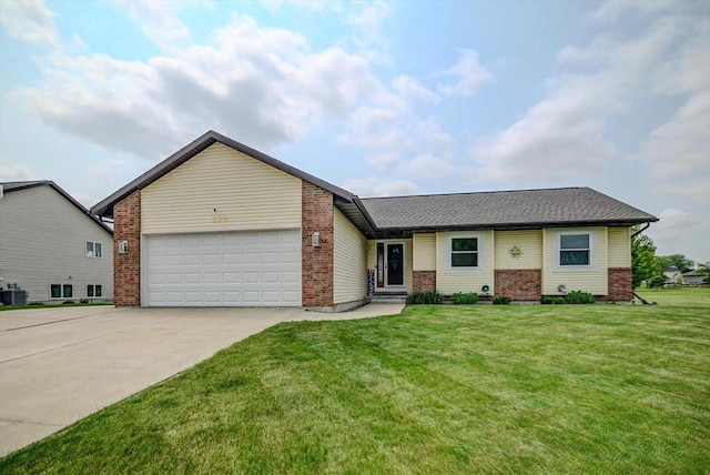 830 Violet Ln, Oregon, WI 53575 - view of front facade featuring brick siding, concrete driveway, a garage, and a front yard