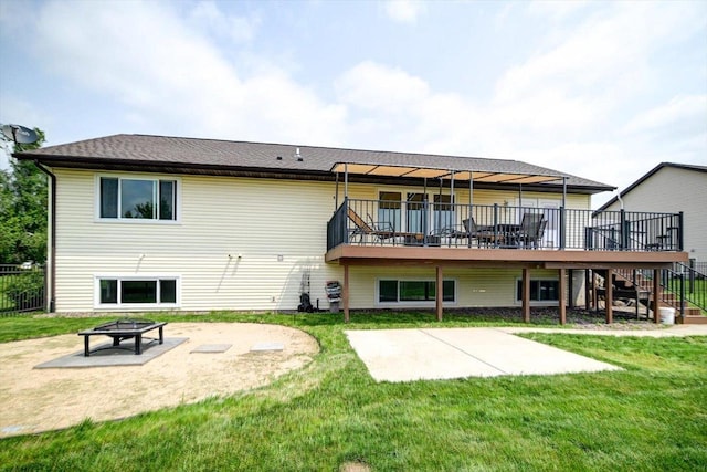 830 Violet Ln, Oregon, WI 53575 - back of house with a patio, a wooden deck, an outdoor fire pit, and a lawn