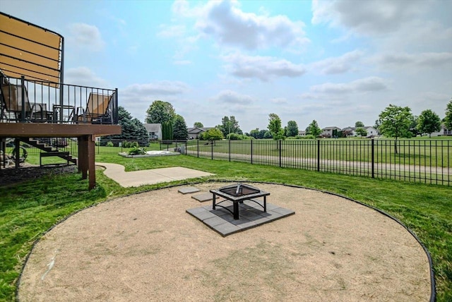 830 Violet Ln, Oregon, WI 53575 - view of home's community with an outdoor fire pit, stairway, a deck, and a patio