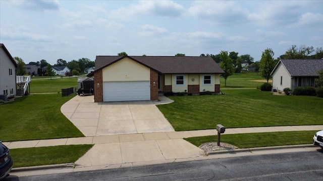 830 Violet Ln, Oregon, WI 53575 - view of front facade with a front lawn, brick siding, an attached garage, and driveway