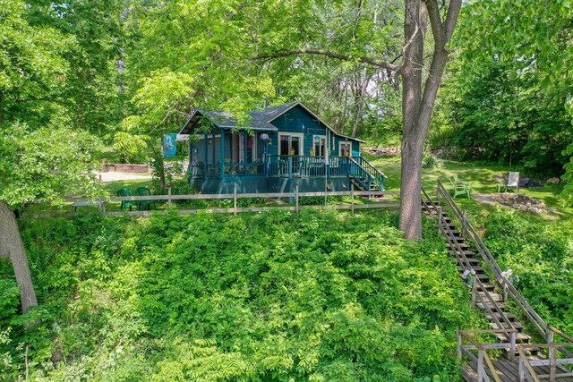 9034 N County Road F, Edgerton, WI 53534 - back of house featuring stairs and a wooden deck