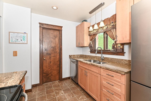 2517 Ashland Ave, Racine, WI 53403 - kitchen featuring appliances with stainless steel finishes, dark stone counters, light brown cabinetry, and pendant lighting