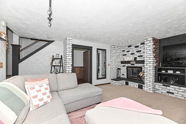 2517 Ashland Ave, Racine, WI 53403 - carpeted living area featuring a brick fireplace and a textured ceiling