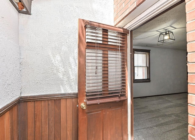 2517 Ashland Ave, Racine, WI 53403 - detailed view of wood walls, wainscoting, and carpet floors
