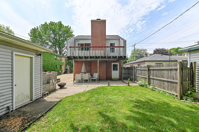 2517 Ashland Ave, Racine, WI 53403 - rear view of property with a patio area, a chimney, and brick siding