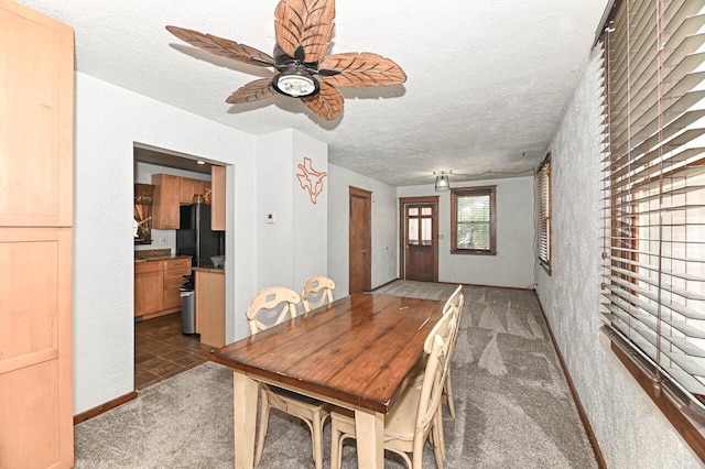 2517 Ashland Ave, Racine, WI 53403 - dining space with ceiling fan, carpet flooring, and a textured ceiling