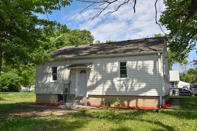 4821 N 58th St, Milwaukee, WI 53218 - back of house featuring a lawn and entry steps