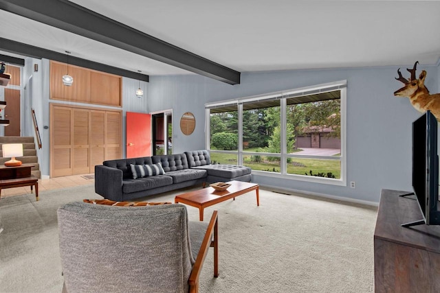 24 Hazelwood Dr, Stevens Point, WI 54481 - carpeted living room with beam ceiling and stairs