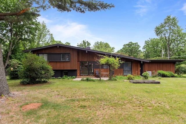 24 Hazelwood Dr, Stevens Point, WI 54481 - rear view of house featuring a yard