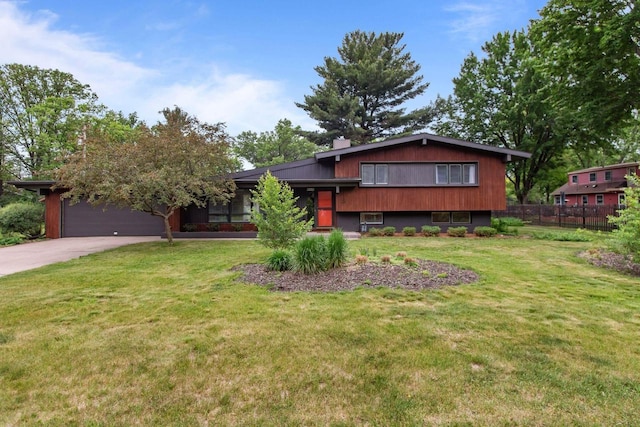 24 Hazelwood Dr, Stevens Point, WI 54481 - tri-level home featuring driveway, an attached garage, and a chimney
