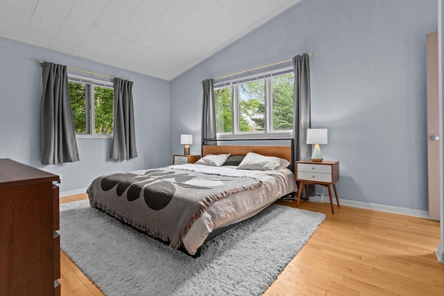 24 Hazelwood Dr, Stevens Point, WI 54481 - bedroom featuring multiple windows, light wood finished floors, and lofted ceiling