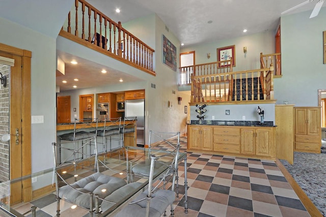 1434 43rd Ave, Kenosha, WI 53144 - kitchen featuring stainless steel built in fridge, a high ceiling, recessed lighting, dark countertops, and open shelves