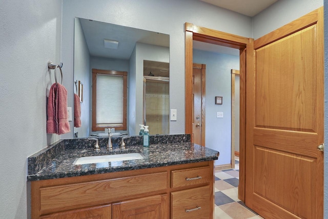 1434 43rd Ave, Kenosha, WI 53144 - full bath featuring vanity, tile patterned floors, a stall shower, and a textured wall