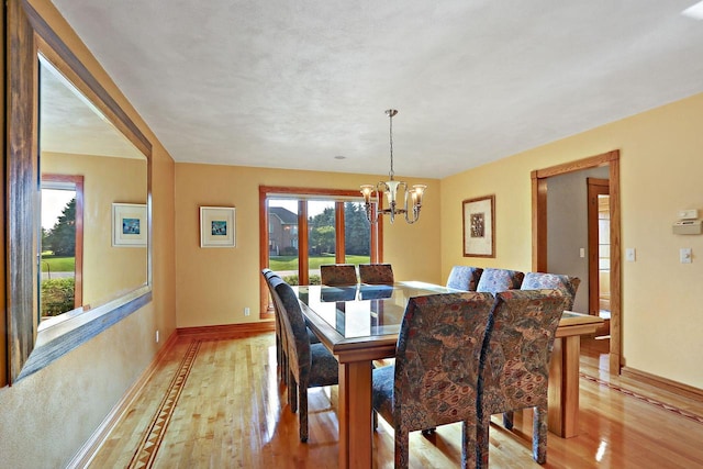 1434 43rd Ave, Kenosha, WI 53144 - dining room with light wood-type flooring and a chandelier