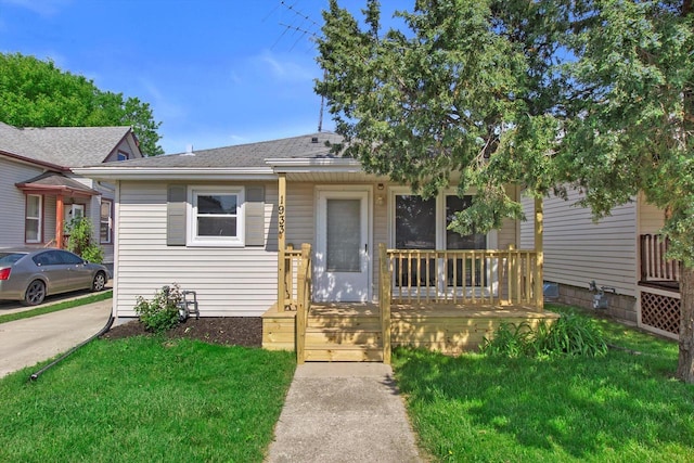 1933 Jay Eye See Ave, Racine, WI 53403 - bungalow-style home featuring a front lawn, roof with shingles, and covered porch