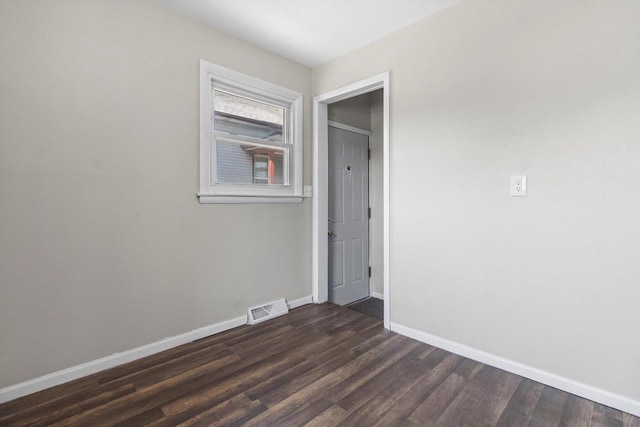 1933 Jay Eye See Ave, Racine, WI 53403 - spare room with dark wood-style flooring and baseboards