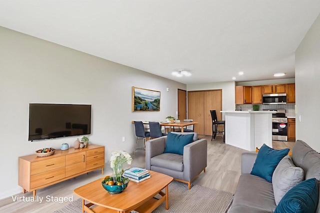 33A Grand Canyon Dr Unit 110, Baraboo, WI 53913 - living area featuring light wood-type flooring and recessed lighting