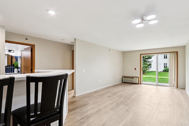 33A Grand Canyon Dr Unit 110, Baraboo, WI 53913 - spare room featuring light wood-style flooring and a wall mounted air conditioner