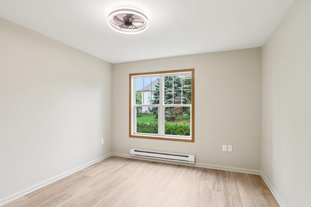 33A Grand Canyon Dr Unit 110, Baraboo, WI 53913 - unfurnished room with baseboard heating and light wood-style flooring
