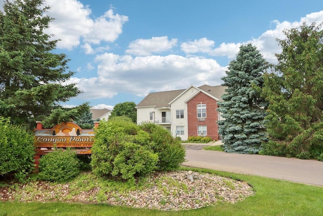 33A Grand Canyon Dr Unit 110, Baraboo, WI 53913 - rear view of house featuring brick siding