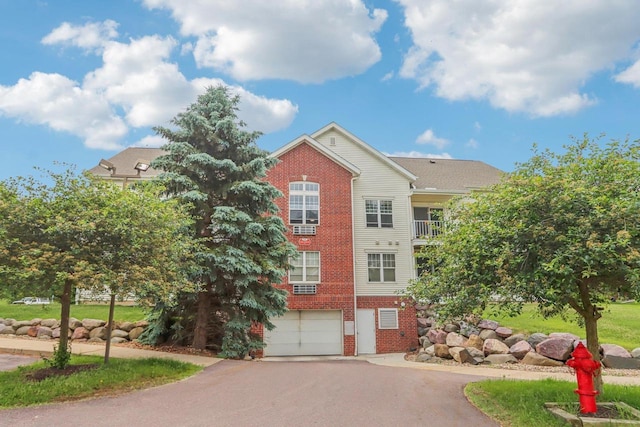 33A Grand Canyon Dr Unit 110, Baraboo, WI 53913 - view of building exterior with asphalt driveway and a garage