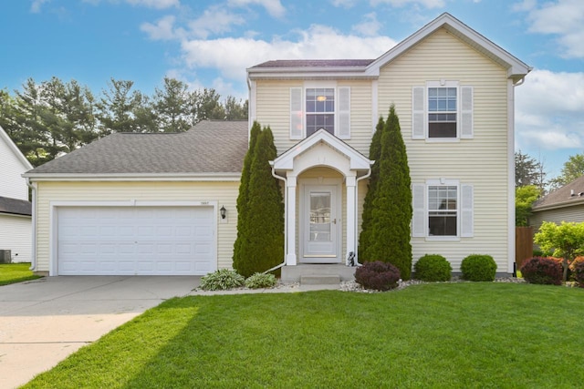 1557 Serena Ln, Burlington, WI 53105 - view of front facade featuring a front yard, driveway, and a garage