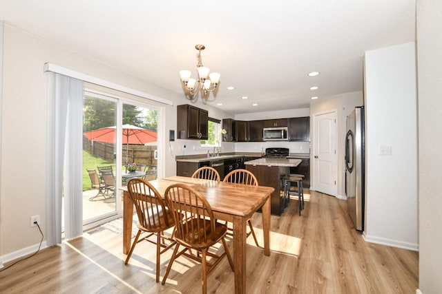 1557 Serena Ln, Burlington, WI 53105 - dining space featuring a chandelier, light wood-style floors, and recessed lighting