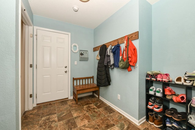 1557 Serena Ln, Burlington, WI 53105 - entryway with dark stone finish floors and baseboards