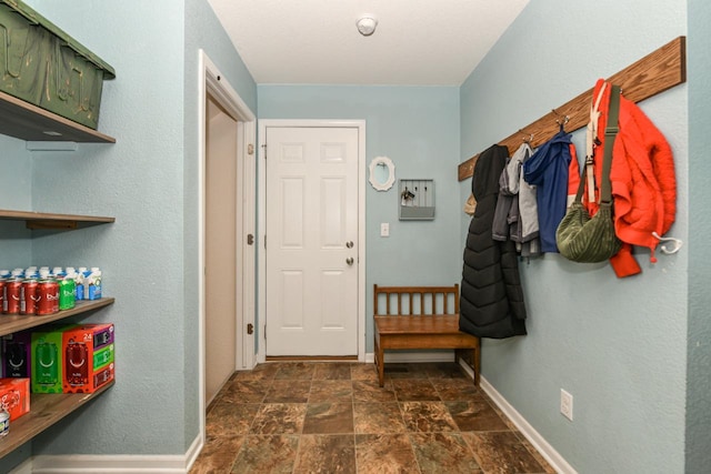 1557 Serena Ln, Burlington, WI 53105 - doorway to outside featuring baseboards and stone finish flooring