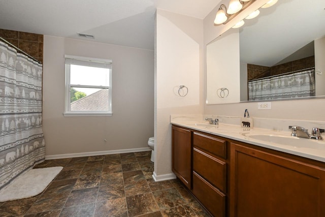 1557 Serena Ln, Burlington, WI 53105 - full bath with double vanity, a shower with shower curtain, and stone finish floors