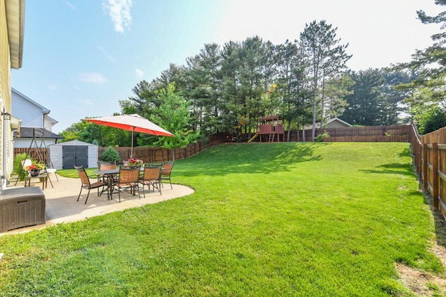 1557 Serena Ln, Burlington, WI 53105 - fenced backyard with a storage shed and a patio