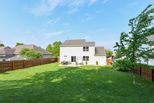 1557 Serena Ln, Burlington, WI 53105 - back of property featuring a fenced backyard and a patio