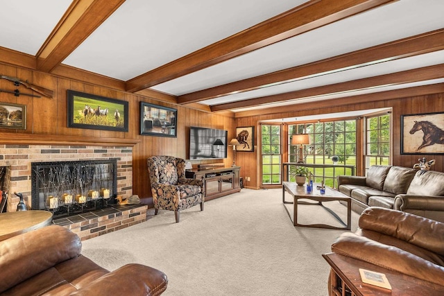 544 Maple Bluff Rd, Stevens Point, WI 54482 - living area with a brick fireplace, beam ceiling, wooden walls, and carpet flooring